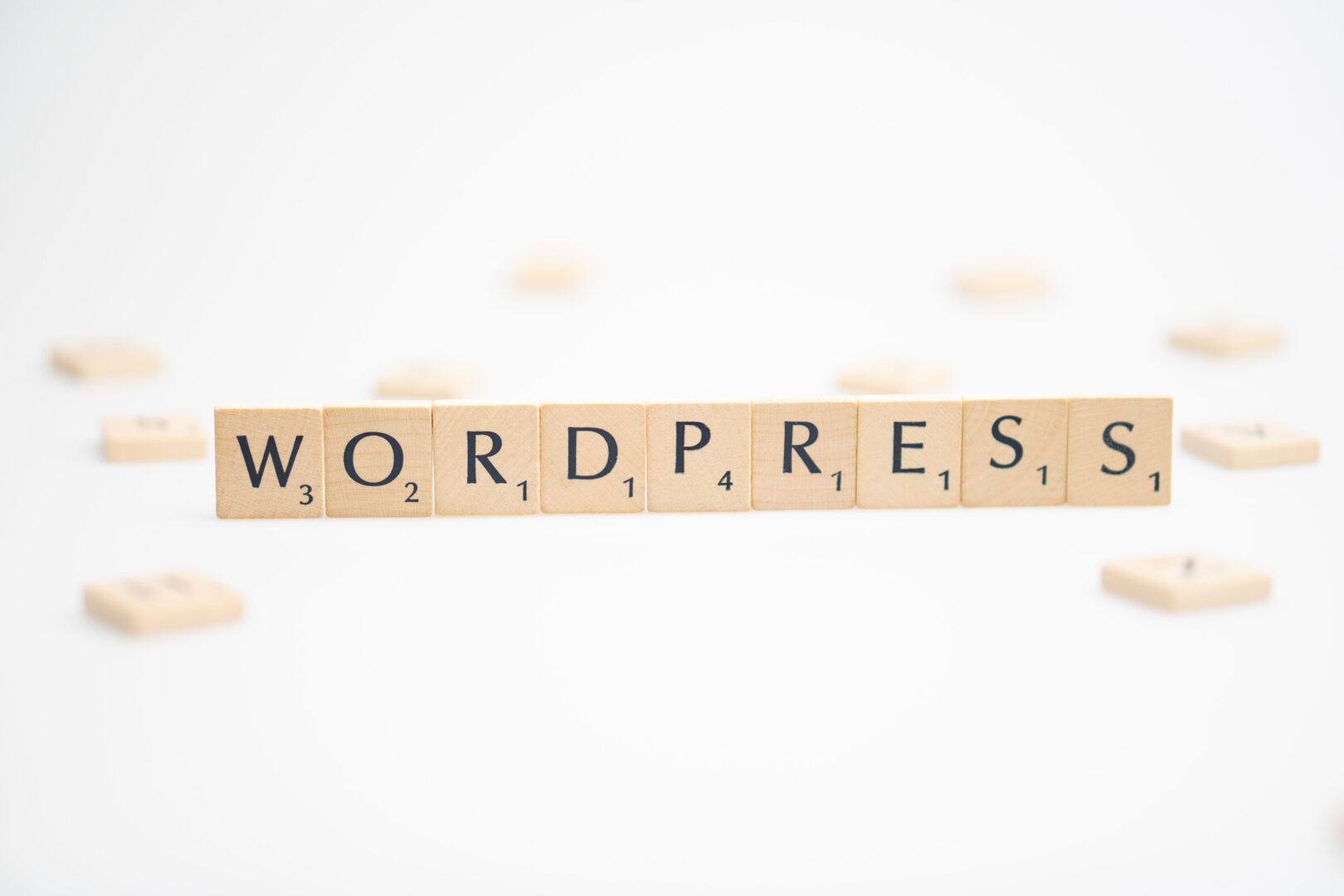 WordPress spelled with scrabble letter tiles
